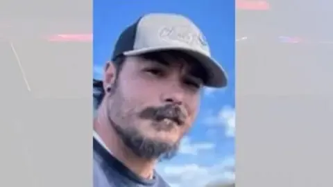 Police locate body believed to be American father accused of murdering his three girls